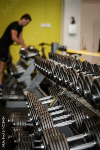 Close up of dumbbells . Row of dumbbells. Gym equipment. Row of dumbbells. fitness center.