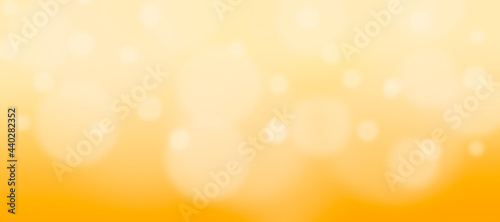 Bright yellow and gold summer sunny abstract background with bokeh and defocus