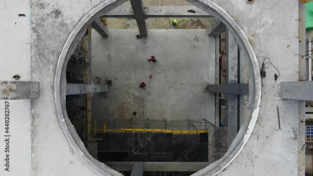 custom made wallpaper toronto digitalDrone flies from a circle whole on a floor at a construction site. 