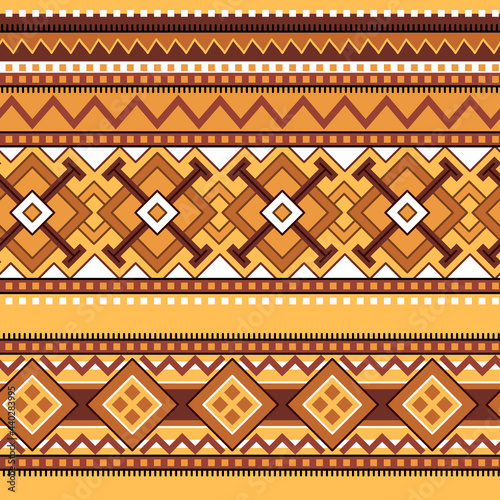 Original seamless pattern of stripes with geometric ornament in ethno style. Ocher coloring.