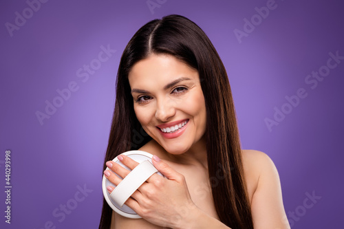 Photo of sweet shiny mature woman naked shoulders smiling pampering skin isolated violet color background