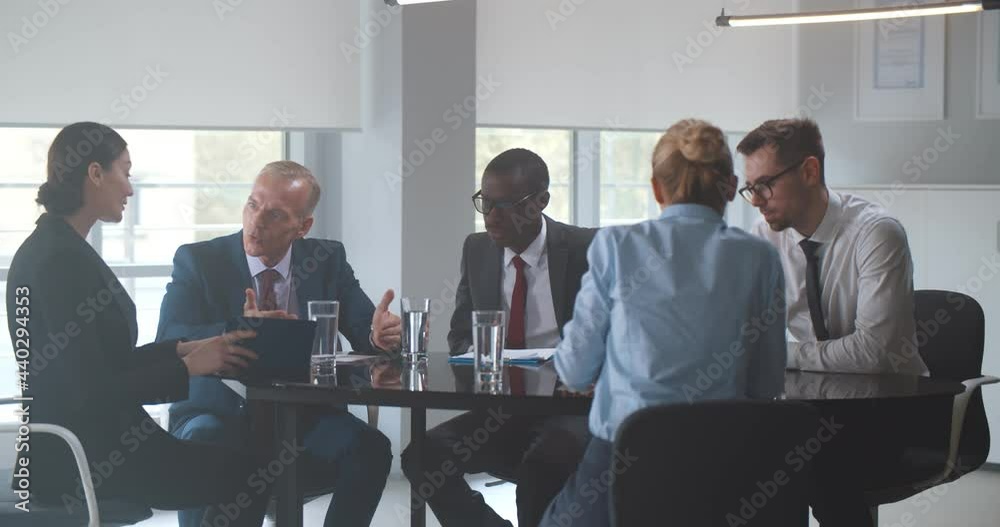 Business team leaving office after successful corporate meeting