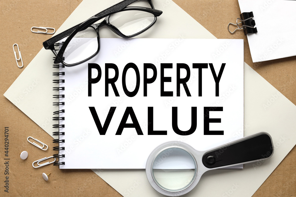 Property Value. text on white notepad on craft background Property Value. text on white notepad on craft background