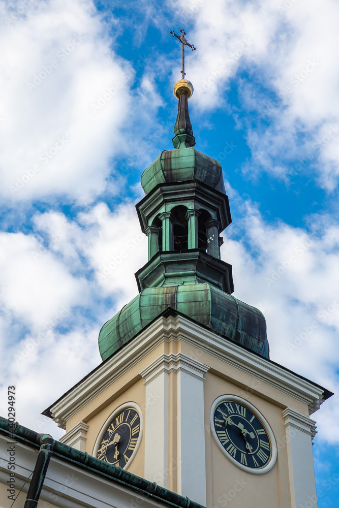 The facade of the Catholic church against the blue sky. Photo taken in natural light on a sunny day. The facade of the Catholic church against the blue sky. Photo taken in natural light on a sunny day.