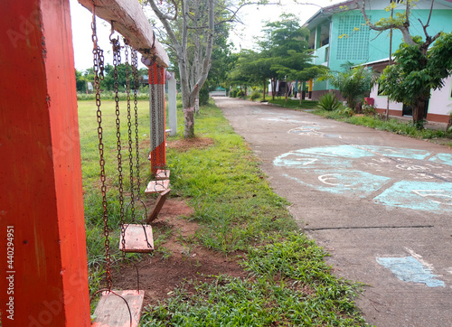An old swing listens to the quiet surroundings of the school after the COVID-19 situation.