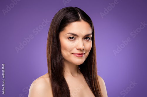 Portrait of attractive naked woman with fresh pure shine skin tone perfection isolated over bright violet purple color background