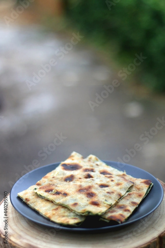 Thin dough filled with mangold, garlice and olive oil. Traditional food in Dalmatia, Croatia. Selective focus. photo