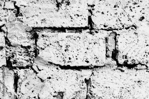 Texture of a brick wall with cracks and scratches which can be used as a background