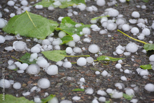 Icy hail on a road after thunderstorm