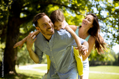 Happy young family with cut...