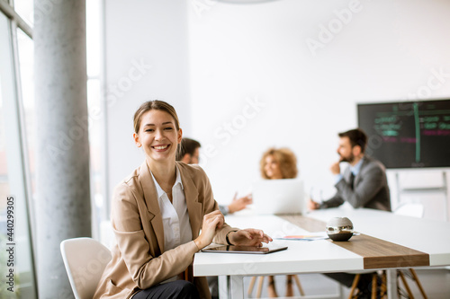 Young woman sitting by the ...