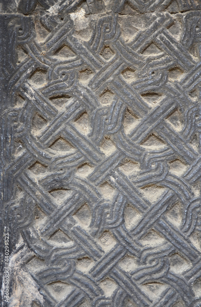 Ornaments on a stone wall of an ancient church Ornaments on a stone wall of an ancient church