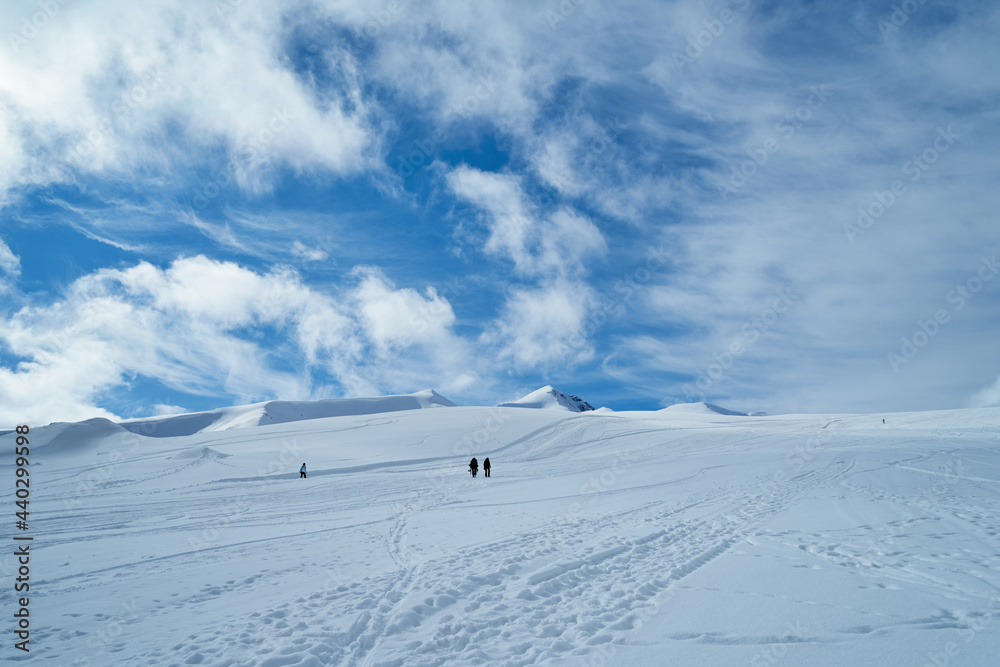 The image of snowboarders on a snowy mountain top. The image of snowboarders on a snowy mountain top.