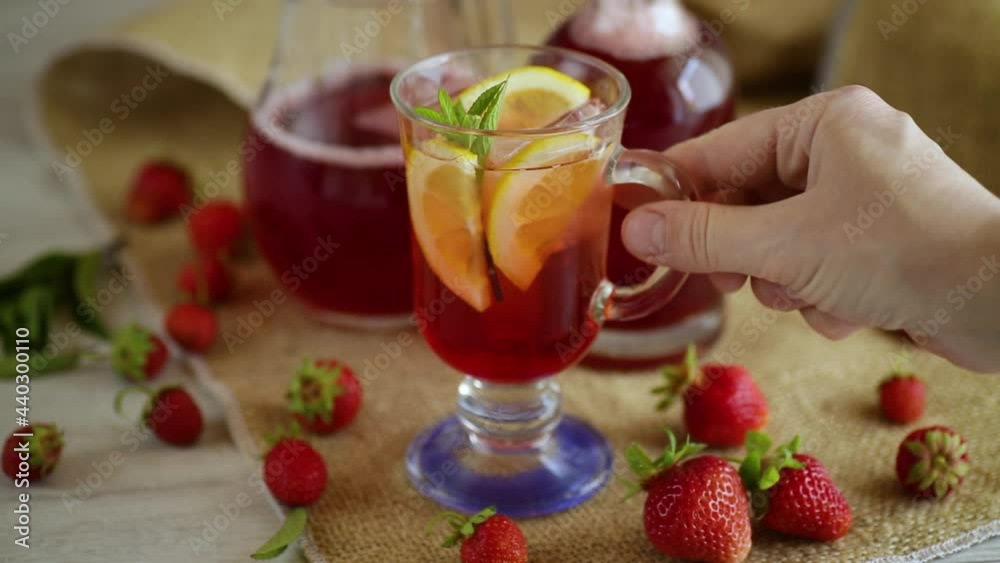 refreshing cool strawberry lemonade with lemon, ice and mint in a glass refreshing cool strawberry lemonade with lemon, ice and mint in a glass