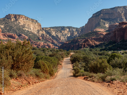 Dirt Road Leading to Rugged Red Rock Mountains in Central Arizona Medium Shot