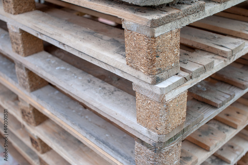 Pallets stacked on top of each other arranged and painted close to one row