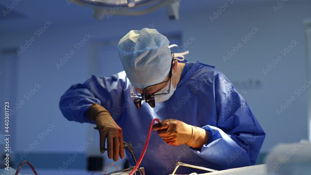 Professional doctor uses surgical tools during operation. Neurosurgeon ...