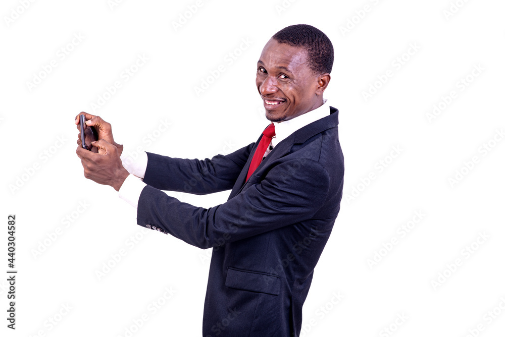 portrait of a businessman in a suit holding cellphone, happy. portrait of a businessman in a suit holding cellphone, happy.
