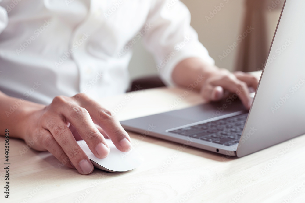 Businessman working with laptop, hands typing on computer keyboard Businessman working with laptop, hands typing on computer keyboard