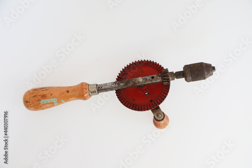 isolated vintage old tool handle drill for wood industry carpentry, Hand equipment tool for manual drill 