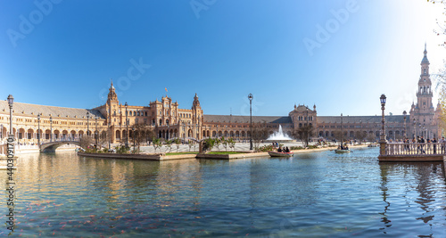 Beautiful and famous Spanish Square - "Plaza de Espana", touristic travel destination in Andalucía. People enjoying a warm day of winter. Recreation, Maria Luisa Park