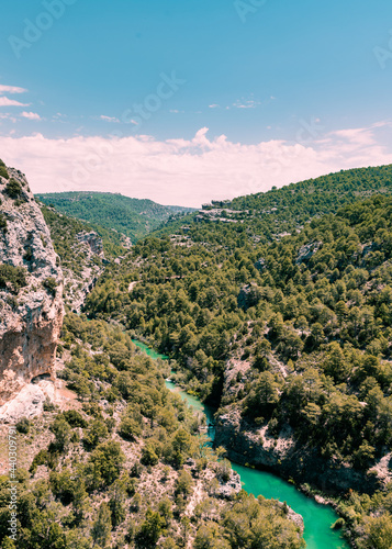 Aerial view of the Tagus River from the viewpoint called Devil's Window in Cuenca province near the town of Uña with rocks, turquoise waters and clouds.