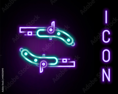 Glowing neon line Vintage pistols icon isolated on black background. Ancient weapon. Colorful outline concept. Vector