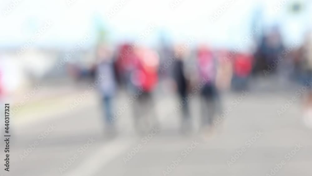 Blurred outlines on group of people walking through city. Blurred outlines on group of people walking through city.