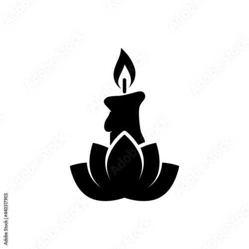 Candle and lotus flower icon isolated on white background