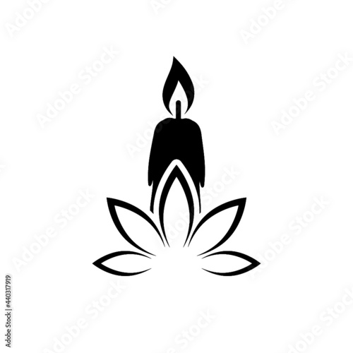 Candle and lotus flower icon isolated on white background