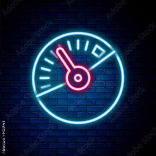 Glowing neon line Speedometer icon isolated on brick wall background. Colorful outline concept. Vector