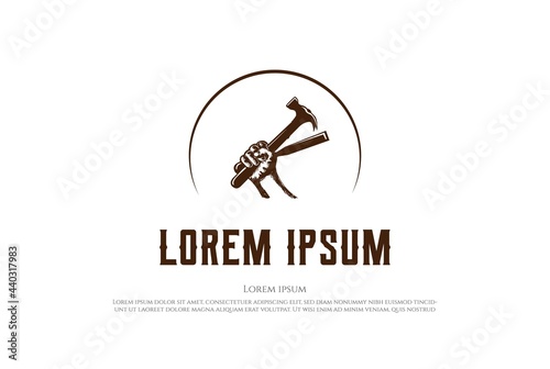 Hipster Rustic Han hold Hammer and Chisel for Carpentry Woodworking Logo Design Vector photo