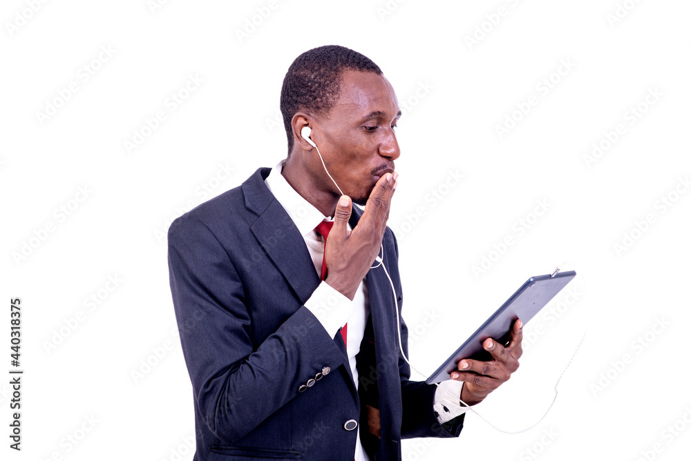 portrait of a happy businessman communicating using a tablet and headphones. portrait of a happy businessman communicating using a tablet and headphones.