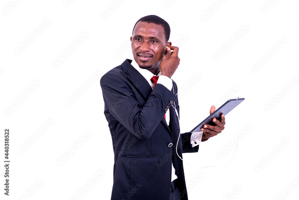 portrait of a businessman communicating using a tablet and headphones, smiling. portrait of a businessman communicating using a tablet and headphones, smiling.