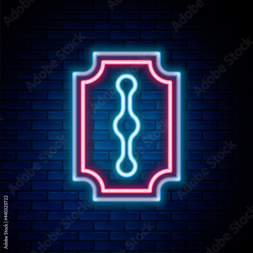 Glowing neon line Blade razor icon isolated on brick wall background. Colorful outline concept. Vector