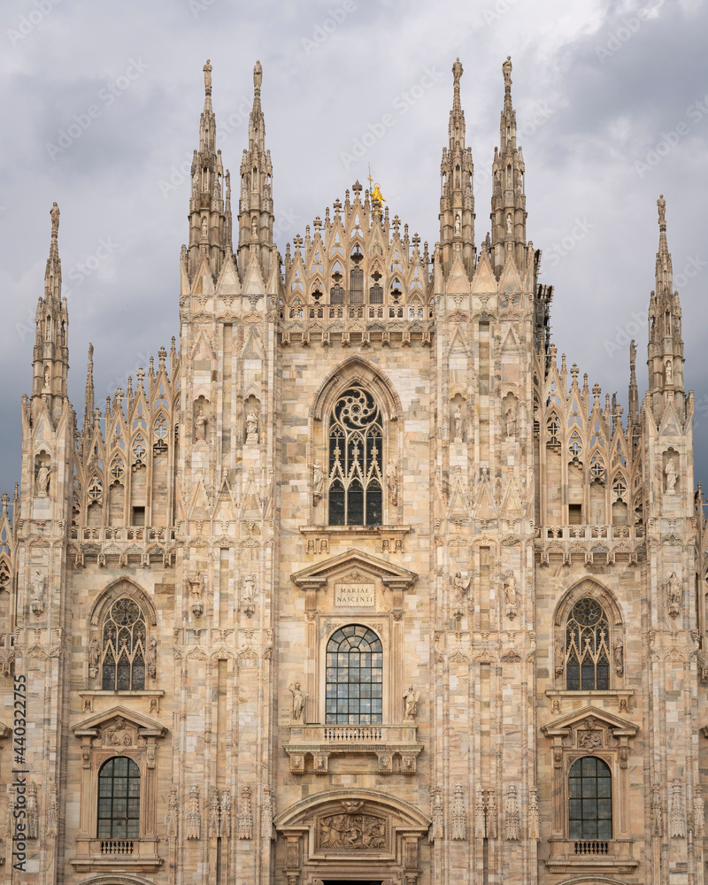 Front view of Duomo with the golden statue name 