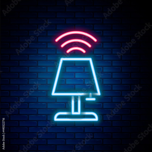 Glowing neon line Smart table lamp system icon isolated on brick wall background. Internet of things concept with wireless connection. Colorful outline concept. Vector