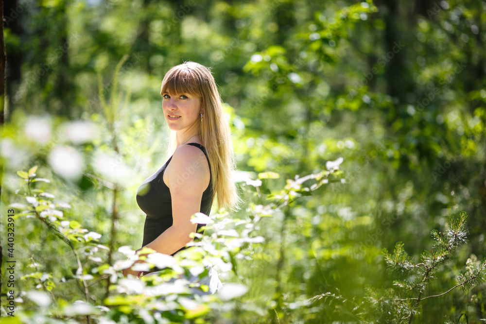 beautiful girl stands in thicket of forest beautiful girl stands in thicket of forest