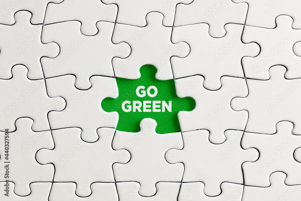 Green missing puzzle piece with the word go green. Green missing puzzle piece with the word go green.