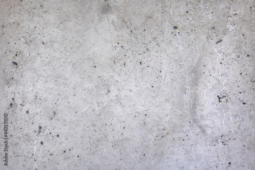 Old grey interior concrete wall, rough texture. Aged grungy with scratch and dirty spots on surface, industrial architecture loft style concept. Abstract material background, monochrome. © Vipada