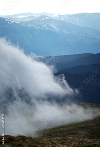 Fototapeta Naklejka Na Ścianę i Meble -  The fog rises over the mountains after the rain