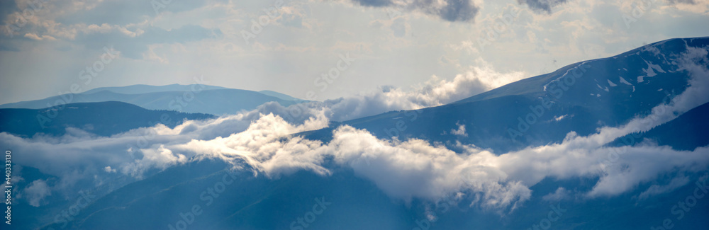 Panorama of the Carpathian mountains in cloudy and foggy weather