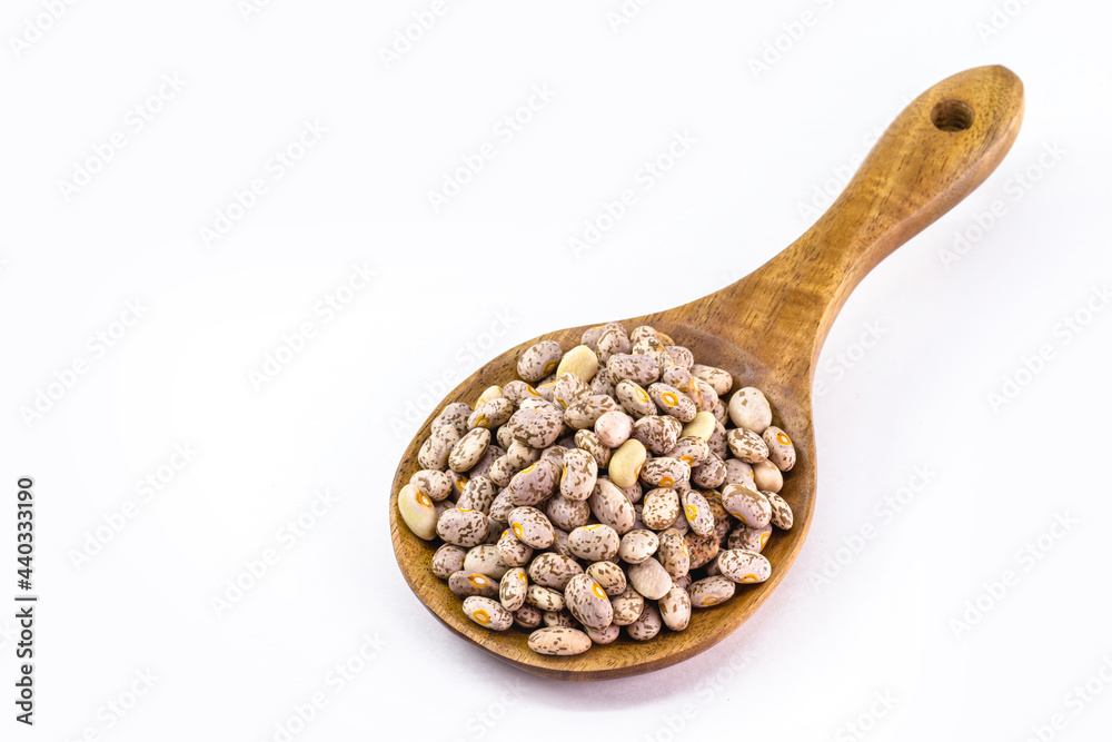 rustic wooden ladle with brazilian beans, wooden spoon, isolated white background and copy space rustic wooden ladle with brazilian beans, wooden spoon, isolated white background and copy space