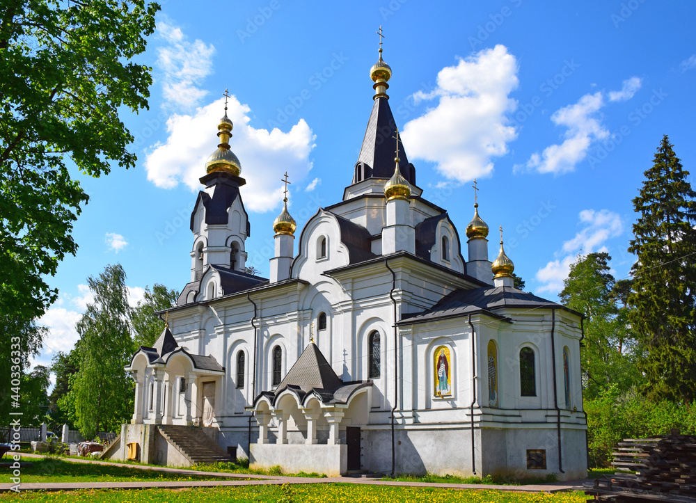Grebnevskaya tent church in pseudo-Russian style with a tent bell tower was built in 2015 on the site of a wooden church that burned down in 2007. The architect is unknown. Moscow, Russia, May 2021.