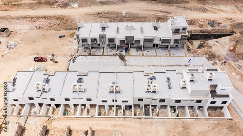 Tableau sur toile Construcción en México construyendo con maquinaria muchas casas juntas en fracci