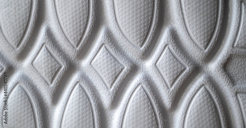 The outsole of new white sneakers. Rubber sole for men's shoes. Sole for sports and walking shoes. The texture of the material of sports shoes photo
