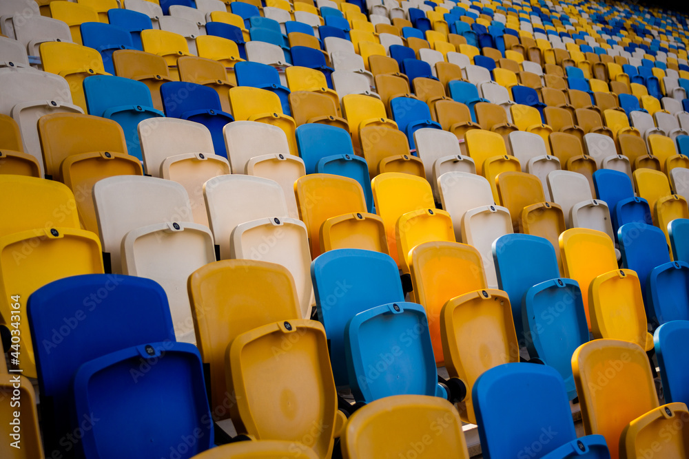 Empty rows of seats in a football olympic stadium Empty rows of seats in a football olympic stadium