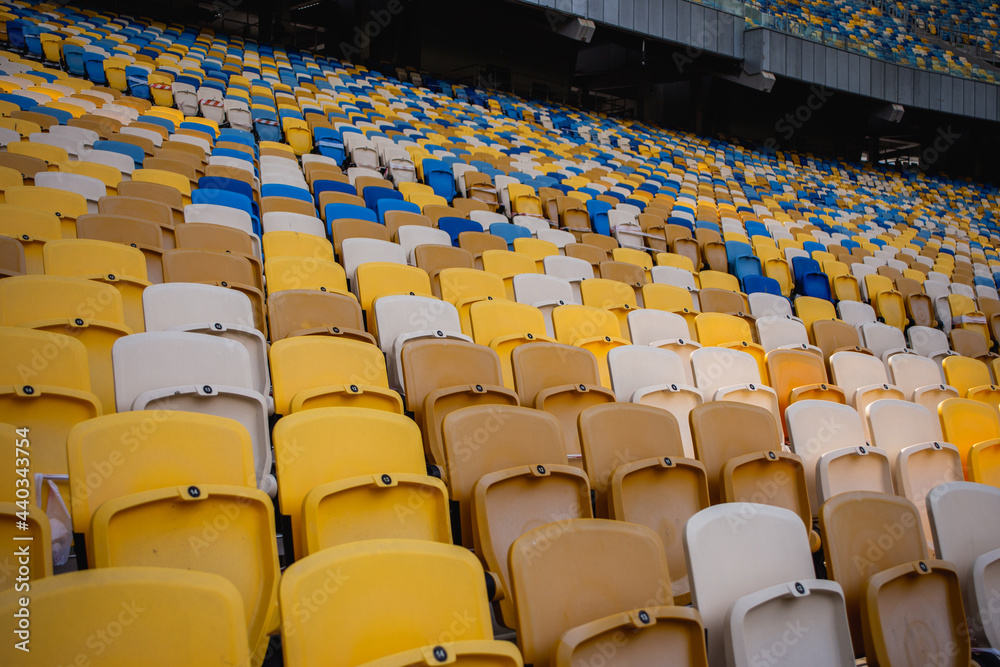 Naklejka premium Empty rows of seats in a football olympic stadium