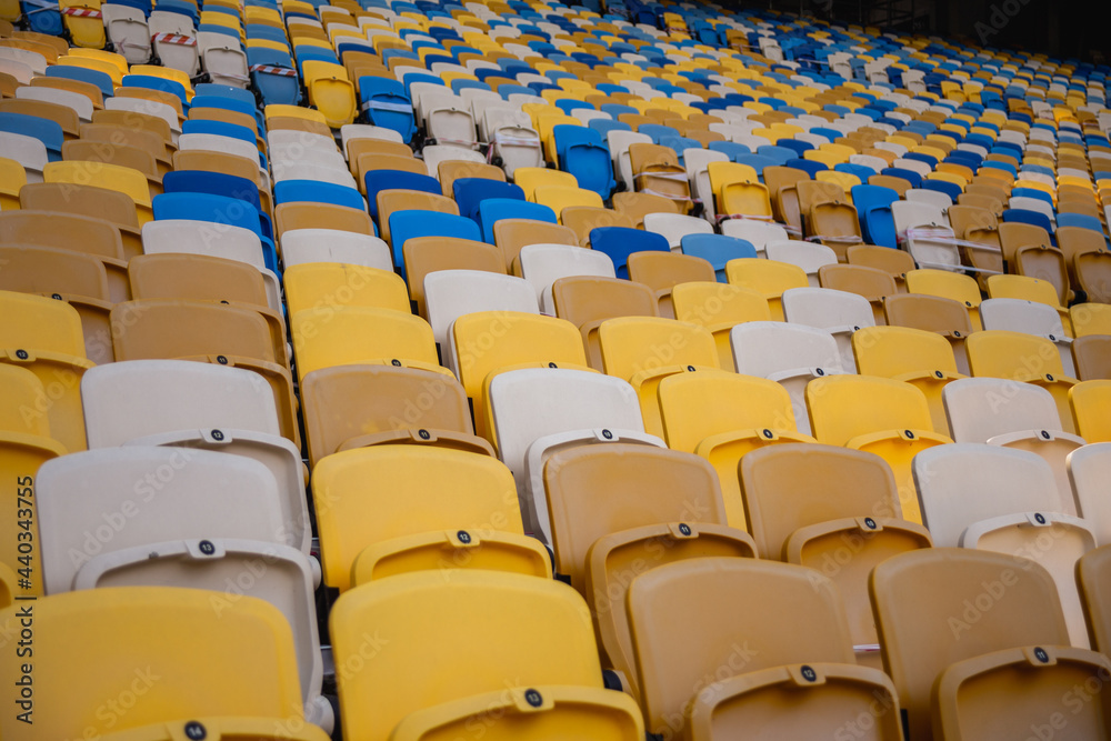 Fototapeta premium Empty rows of seats in a football olympic stadium