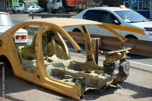 Disassembled car frame on the street. Car after an accident.